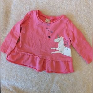 Carter's Pink long sleeve top with peplum bottom. Cute Unicorn detail. 9 Months